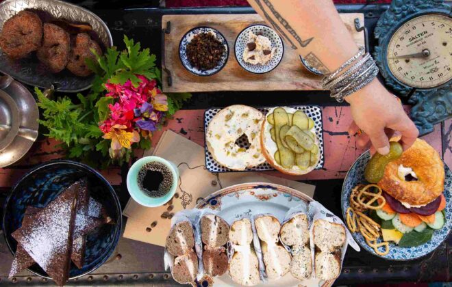 A bunch of bagels on a table at Bury Me Standing Bagels.