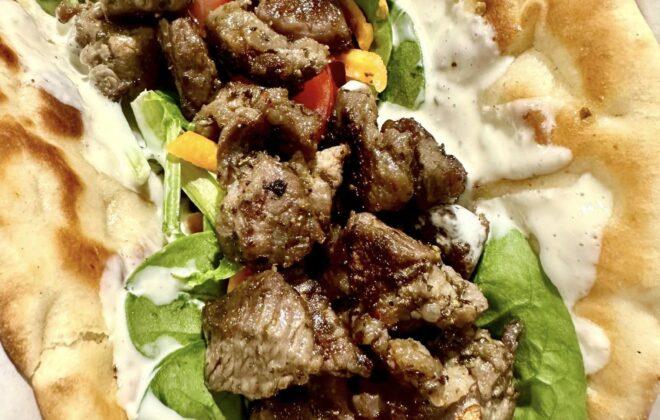 A close up photo of a lamb gyro at Mykonos Cairns.